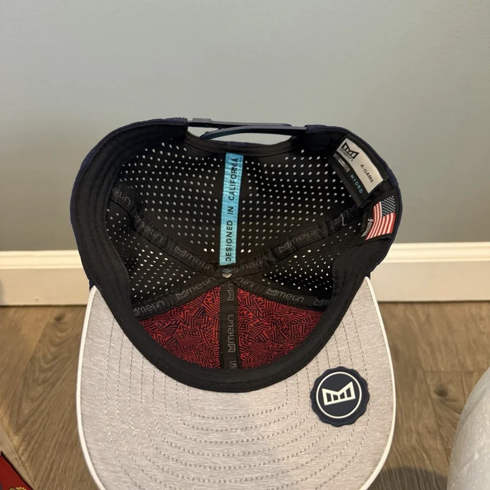 Melin A-Game Hydro Hat Men OSFM Snapback White Navy Blue Americana Patch